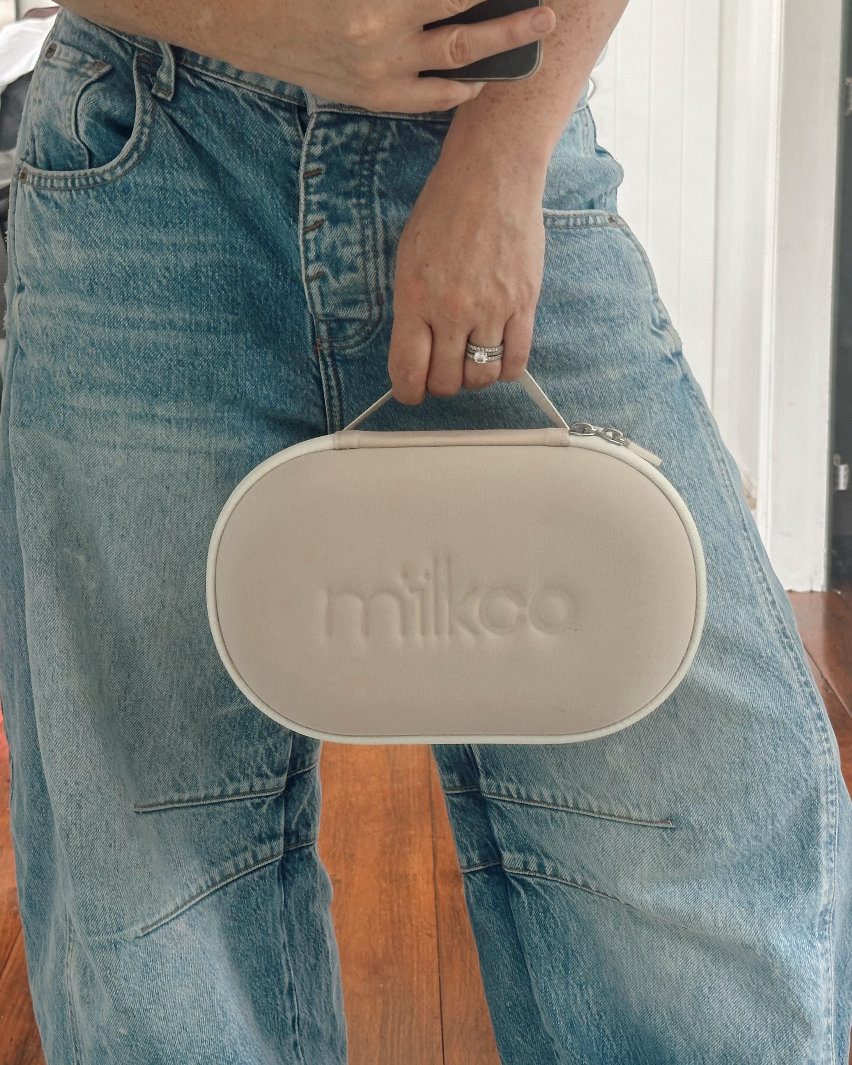 person holding milkco insulated cooler bag